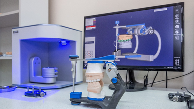 a dental laboratory crafting a prosthetic using digital technology