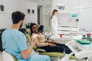 a dentist consulting with a patient about dental implants