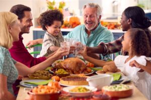 a man eating dinner with his family